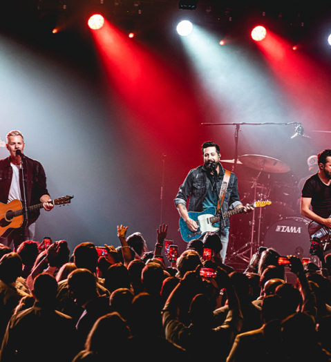 Booking National Entertainment Old Dominion on stage with large crowd on their feet.